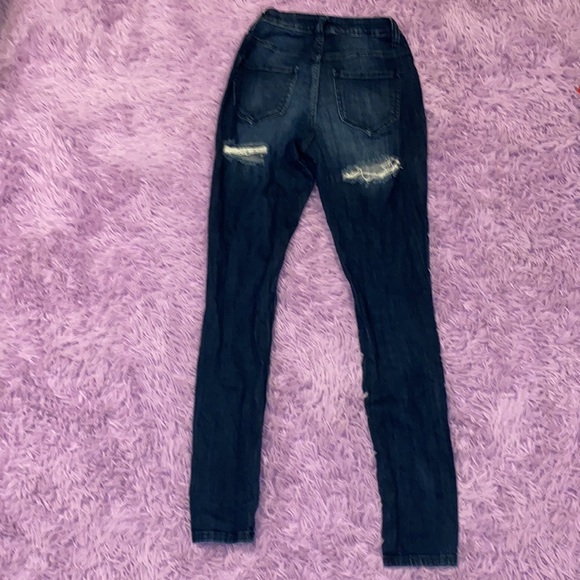 skinny ripped jeans rips on the front and back - Picture 2 of 3